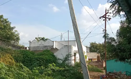 சாய்ந்த மின்கம்பம் சரி செய்யப்படுமா? சாய்ந்த மின்கம்பம் சரி செய்யப்படுமா?