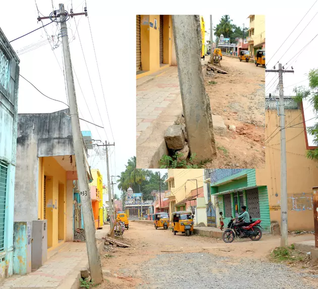 கற்களால் முட்டு கொடுக்கப்பட்ட மின்கம்பம் கற்களால் முட்டு கொடுக்கப்பட்ட மின்கம்பம்