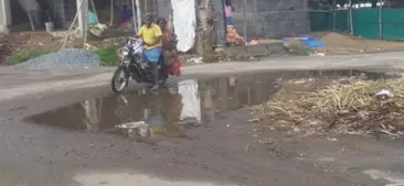 குண்டும்-குழியுமான சாலை